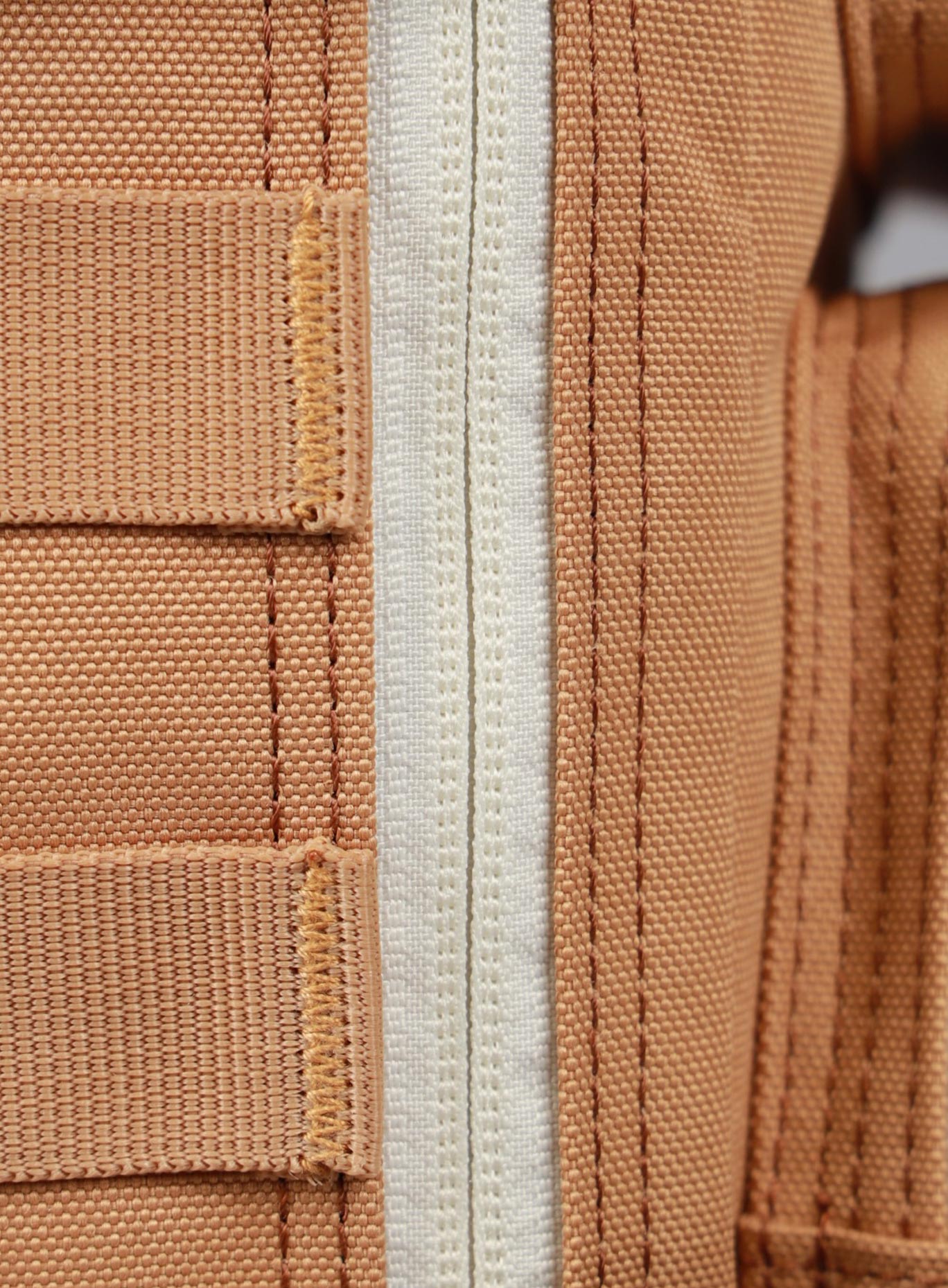 close up picture of the zipper on the 9L Backpack Mini Bombshell Sportswear in Caramel color