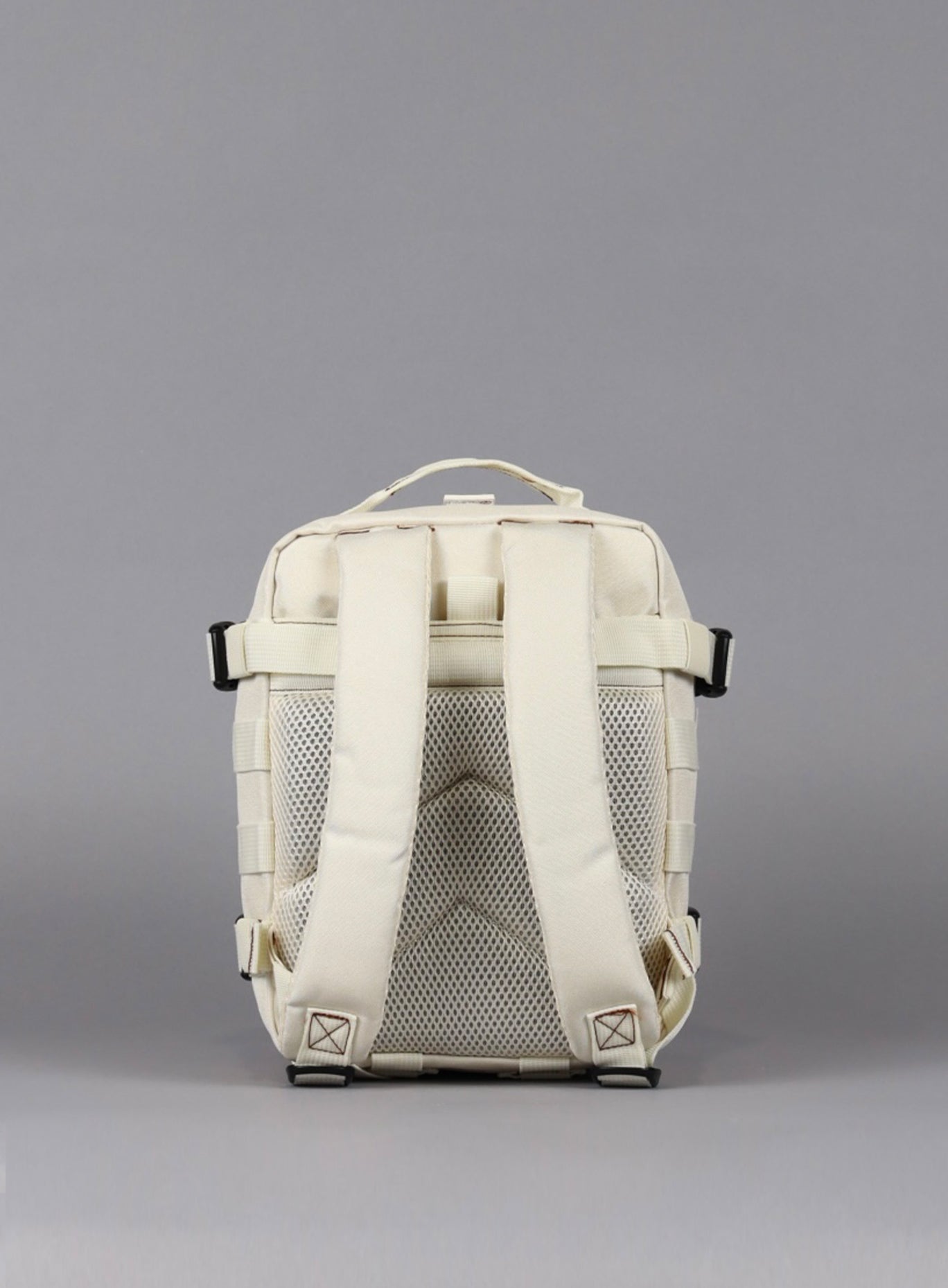 An image featuring the back view of the 9L Backpack Mini Bombshell Sportswear in Crème color