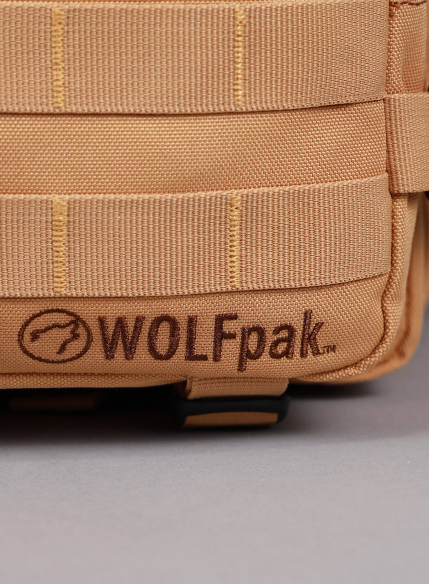 An image highlighting the WOLFpak logo on the   25L Backpack Bombshell Sportswear in Caramel color