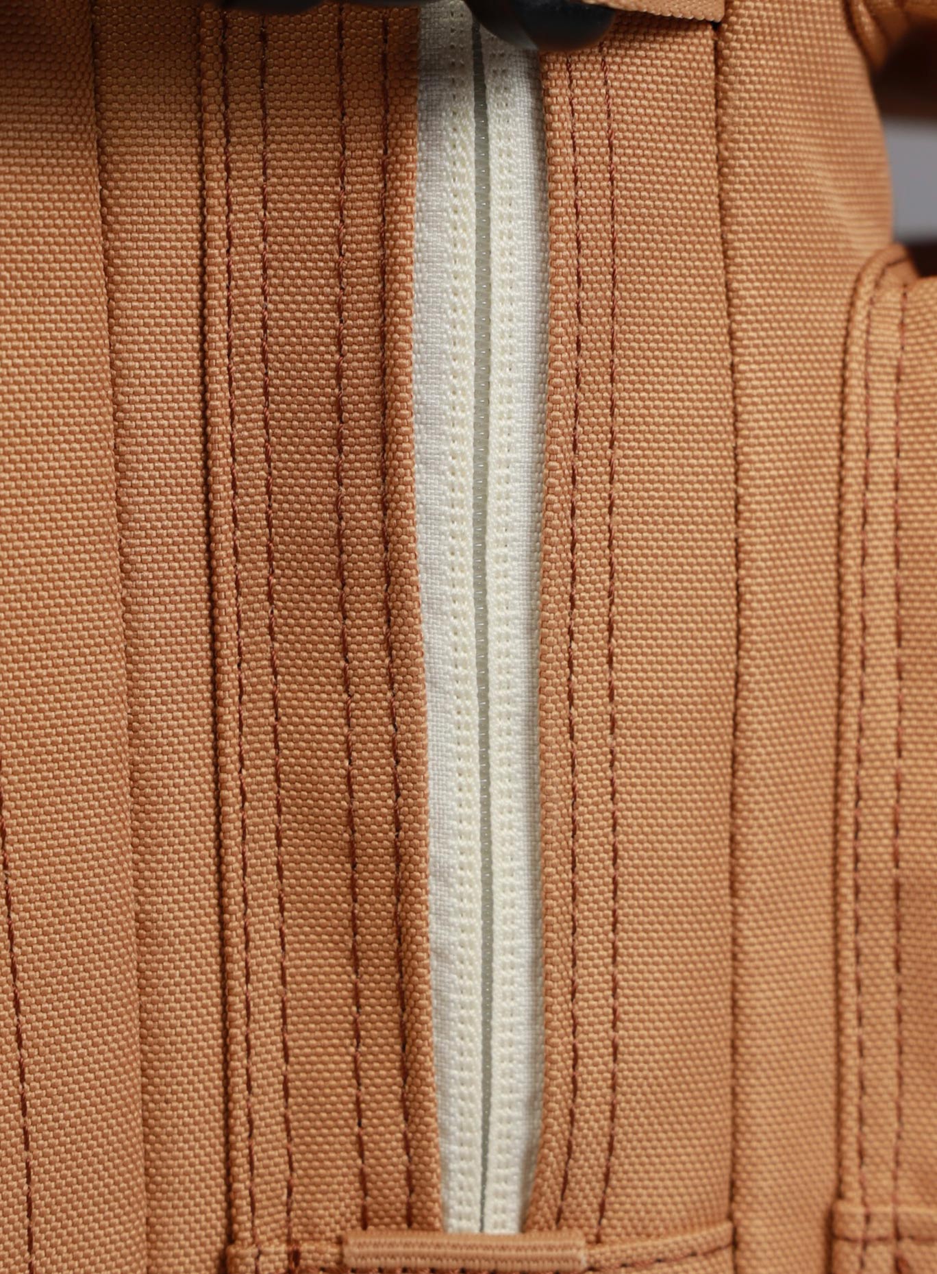 close up picture of the zipper on the   25L Backpack Bombshell Sportswear in Caramel color
