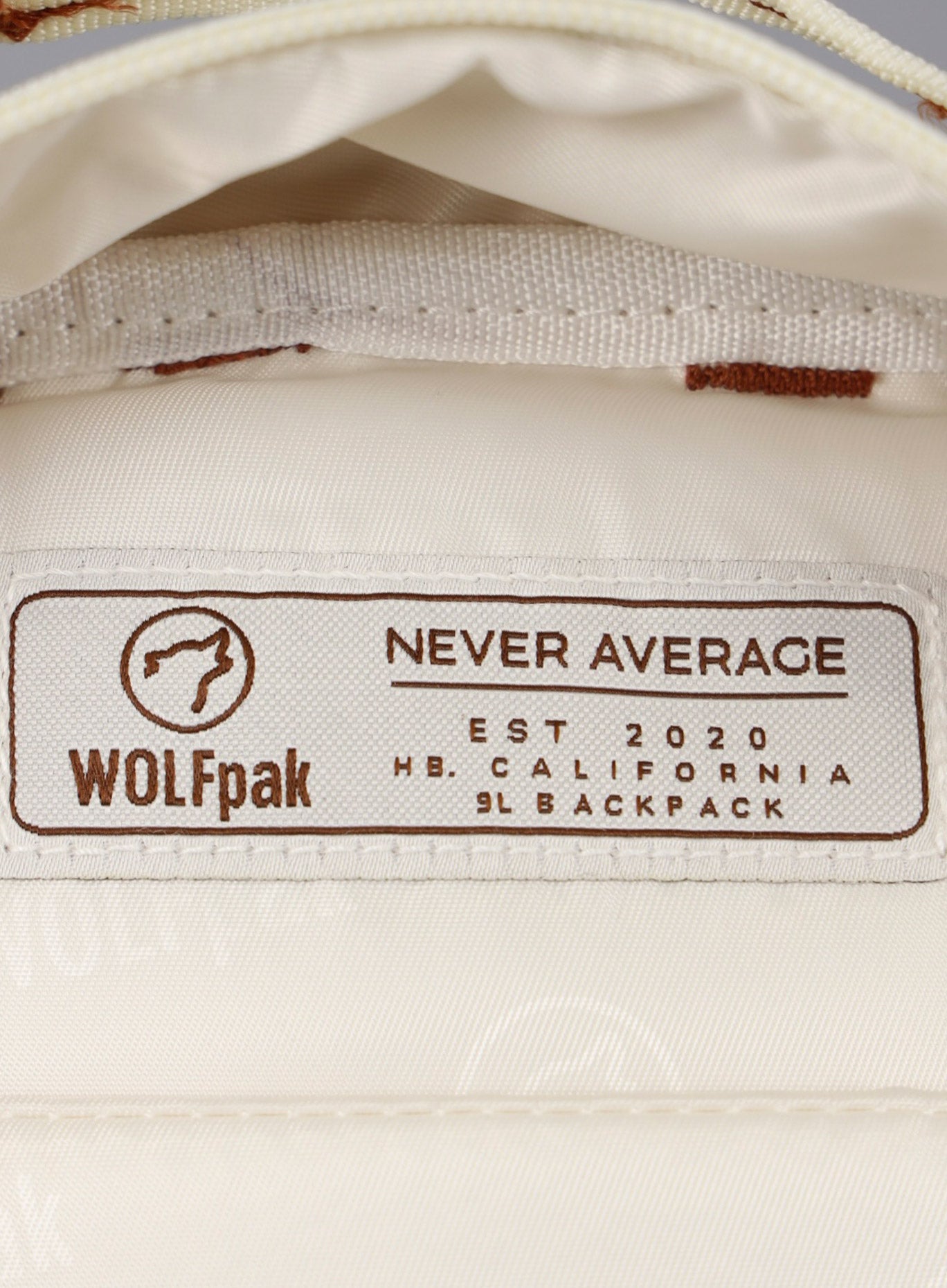 Close up picture of the WOLFpak logo inside the 9L Backpack Mini Bombshell Sportswear in Crème color