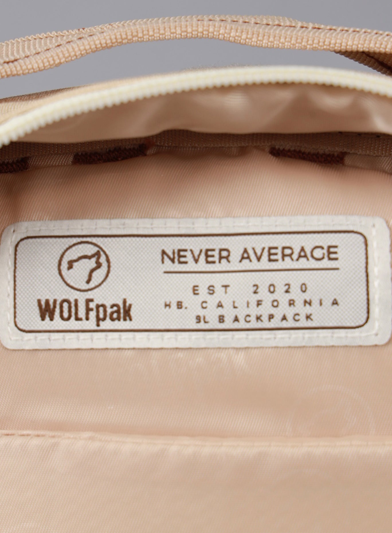 A picture showing the label on the inside of the 9L Mini Bombshell Sportswear Latte backpack