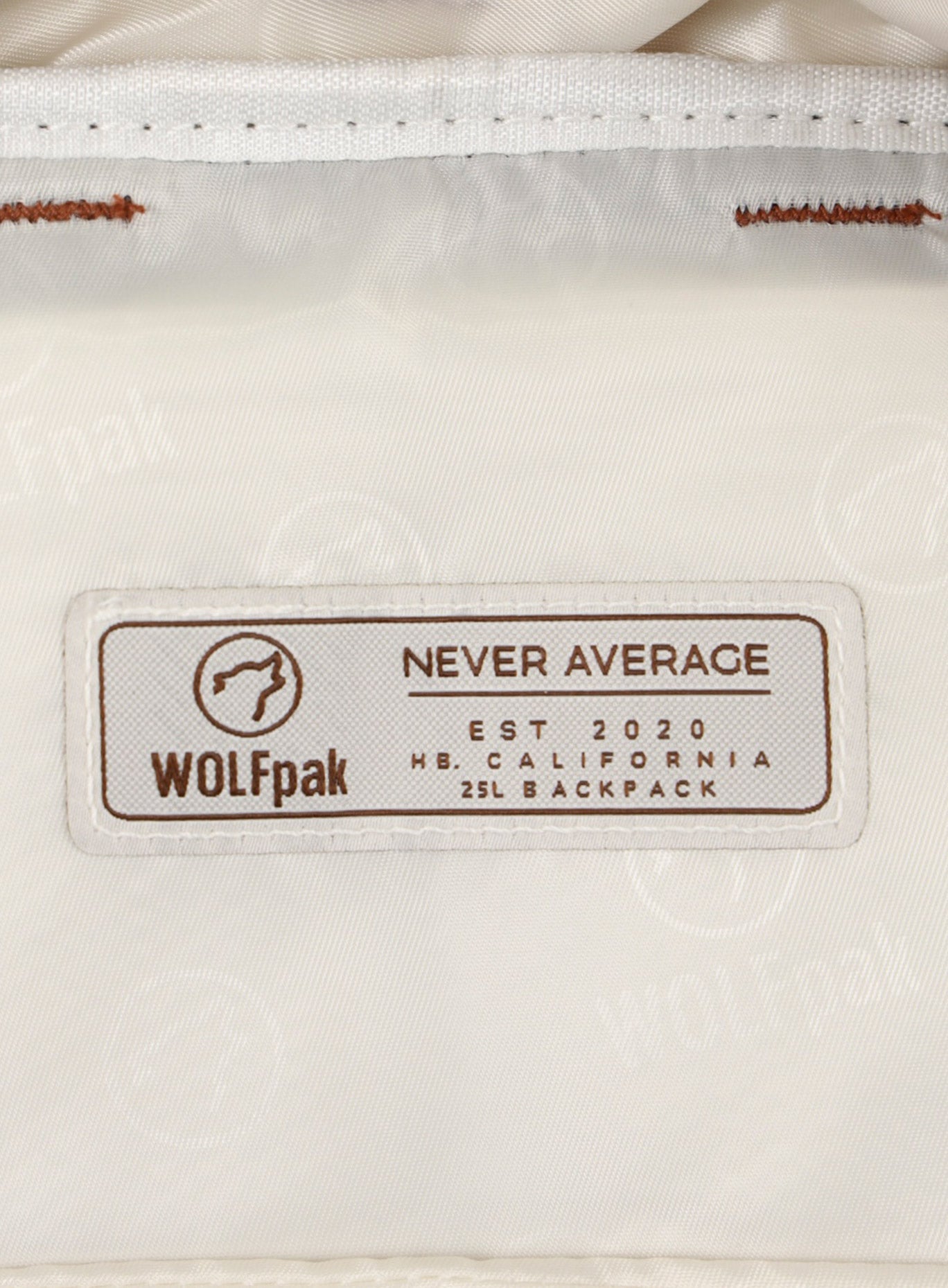 A picture showing the WOLFpak label inside the 25L Backpack Bombshell Sportswear in Crème color