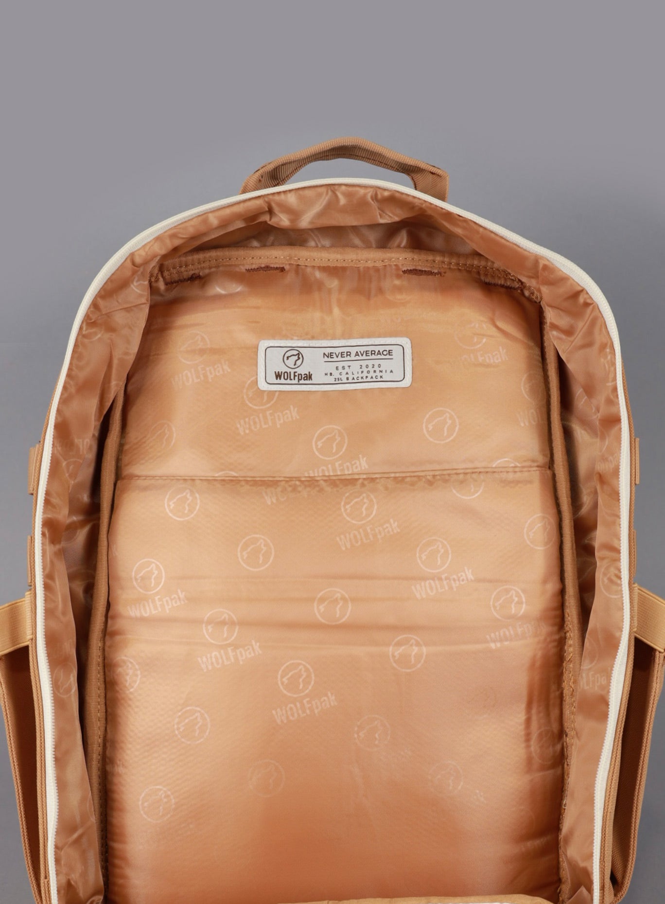 A picture showing the main compartment unzipped on the   25L Backpack Bombshell Sportswear in Caramel color
