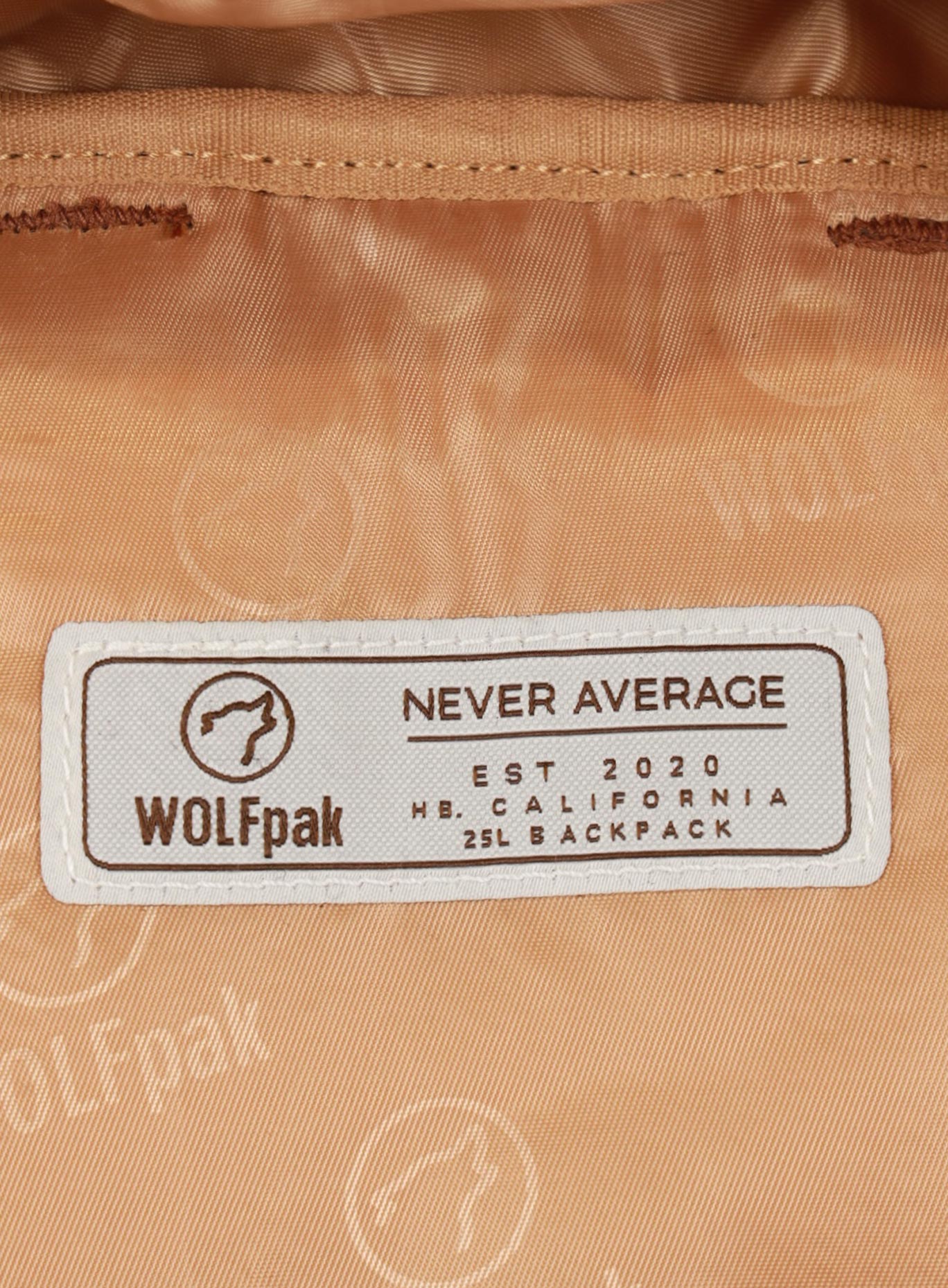 A picture showing the WOLFpak label inside the   25L Backpack Bombshell Sportswear in Caramel color