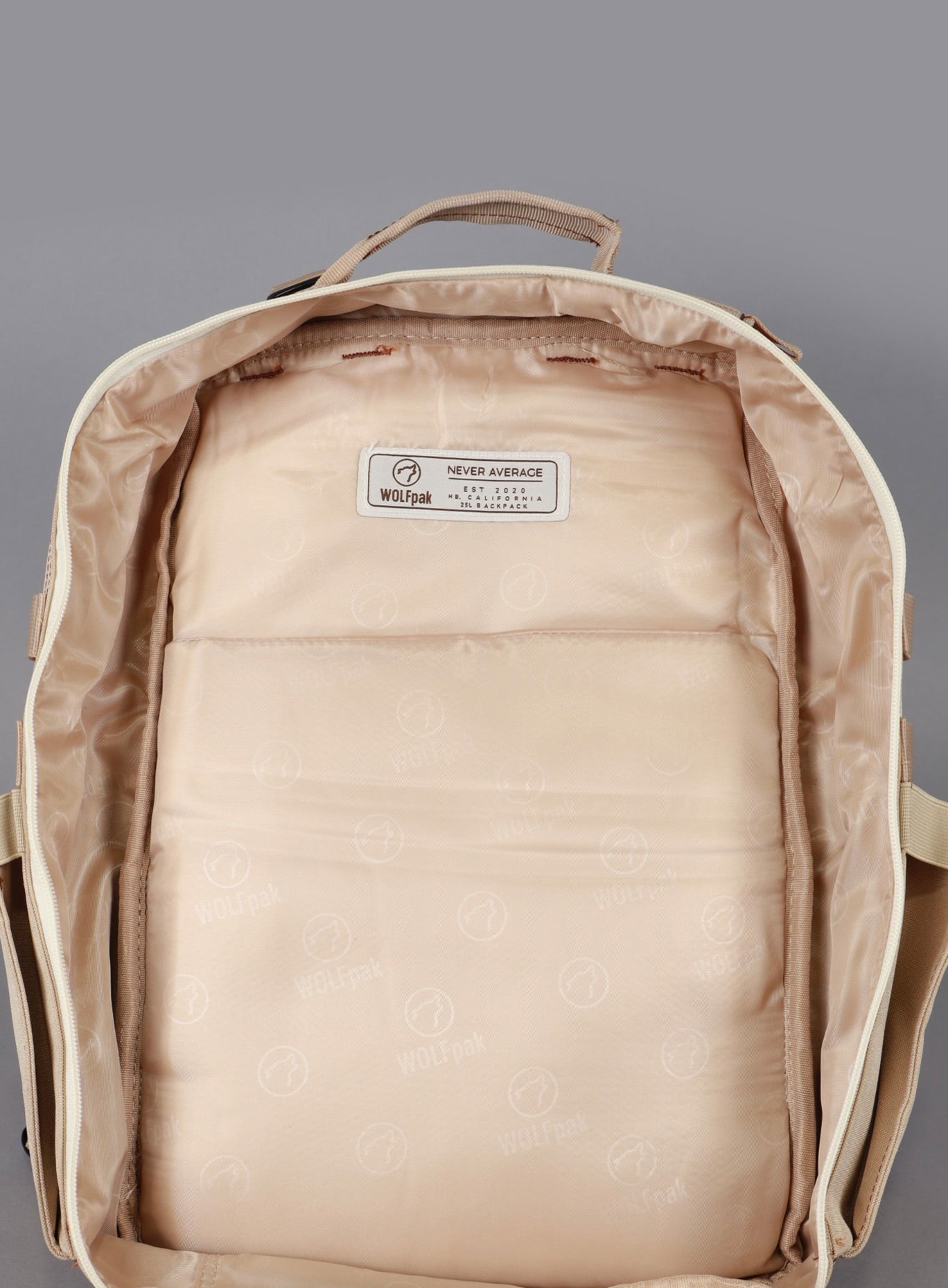 A picture showing the main compartment unzipped on the  25L Backpack Bombshell Sportswear in Latte color