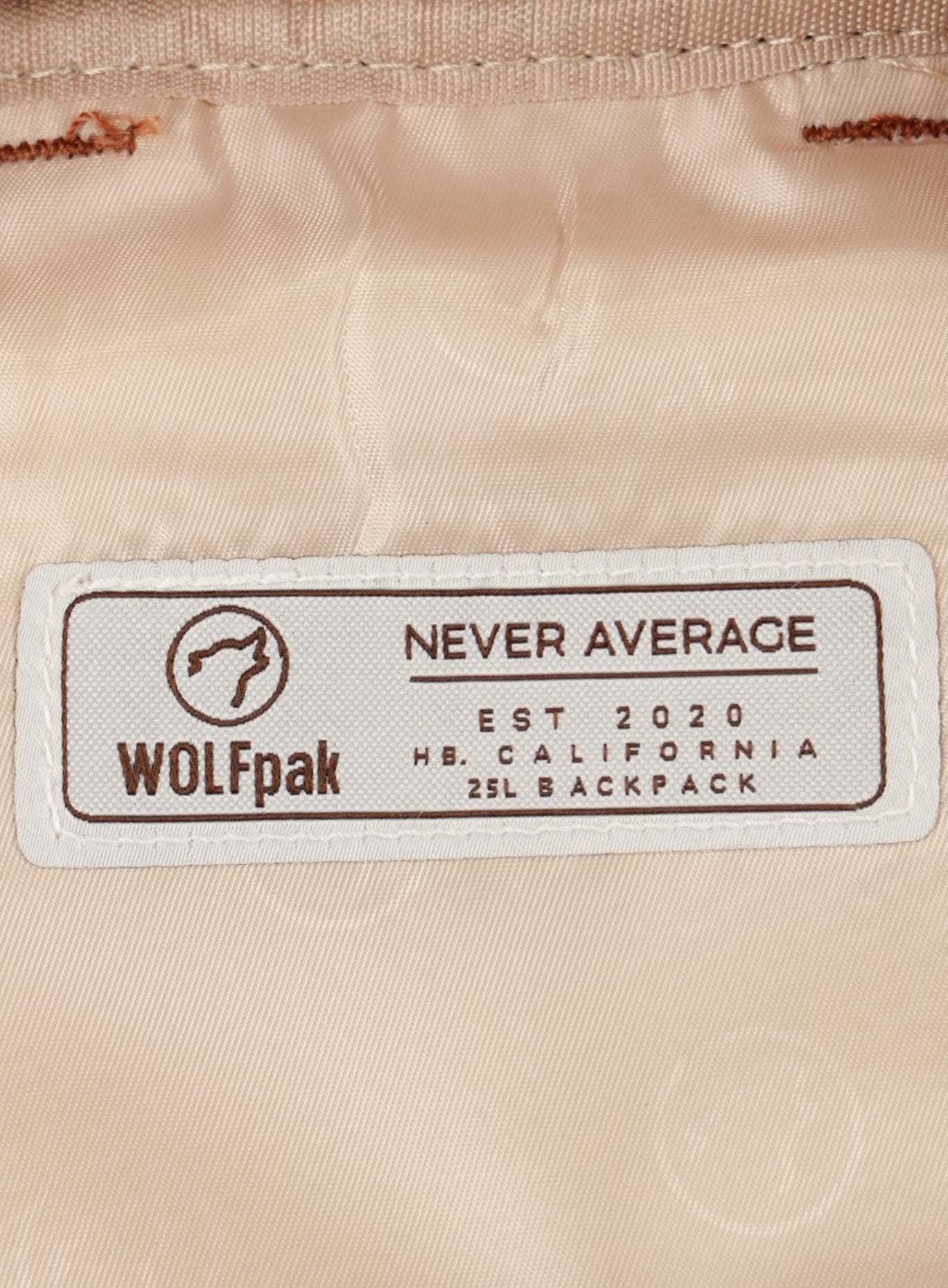 A picture showing the WOLFpak label inside the  25L Backpack Bombshell Sportswear in Latte color