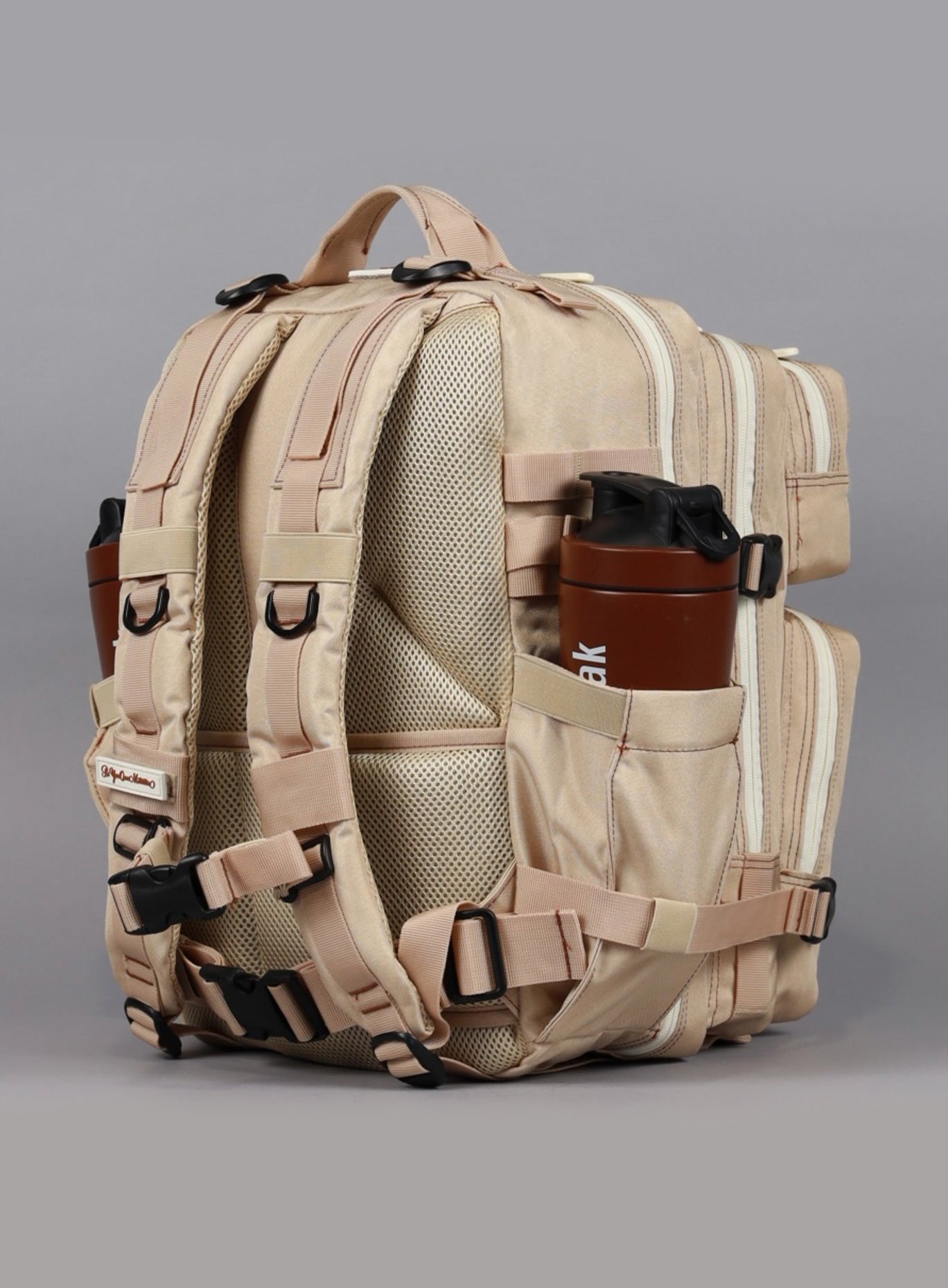 A rear view of the 35L Bombshell Sportswear backpack in Latte color