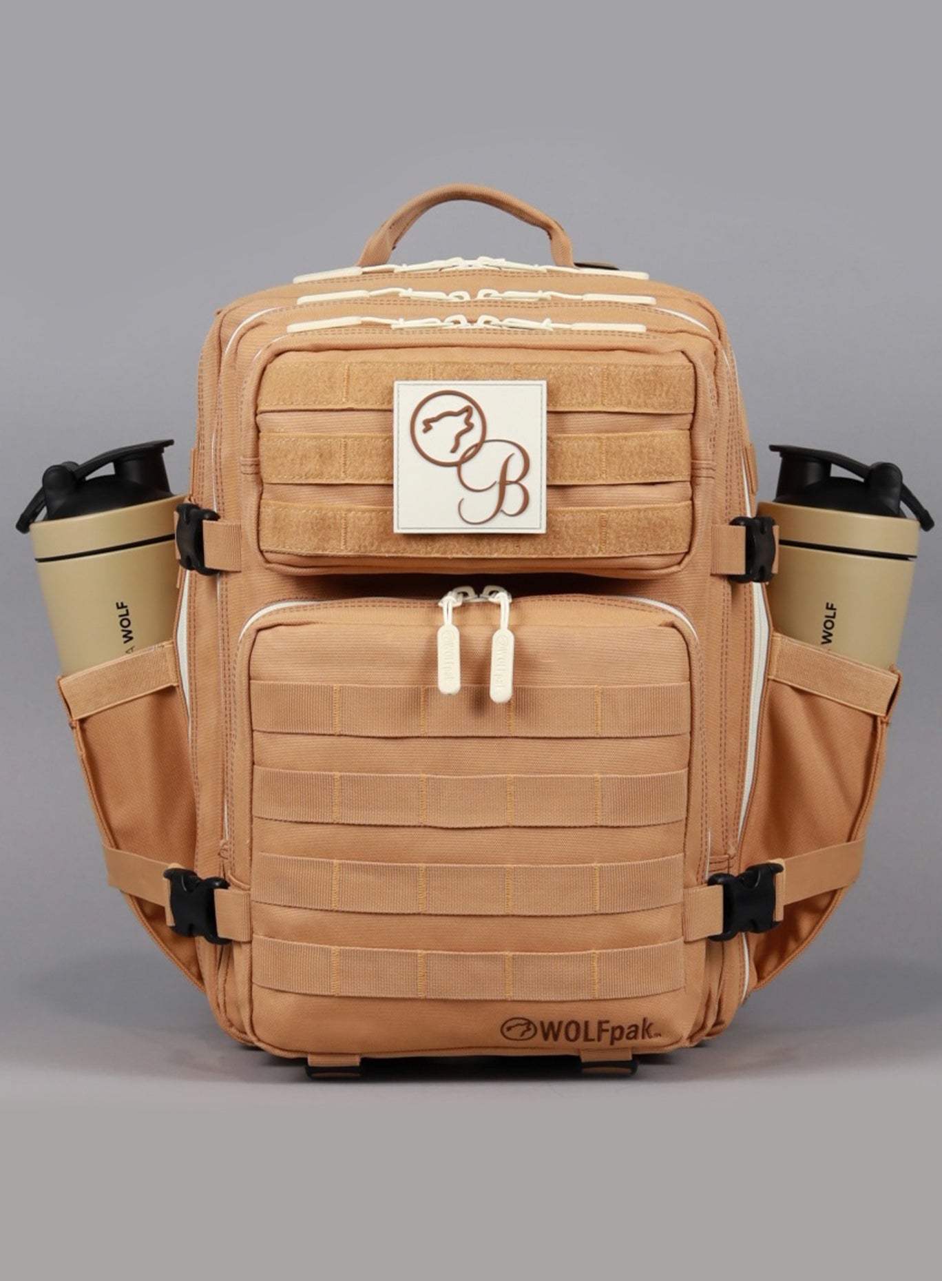 The front view of the 35L Backpack Bombshell Sportswear in Caramel color with water bottles on both sides
