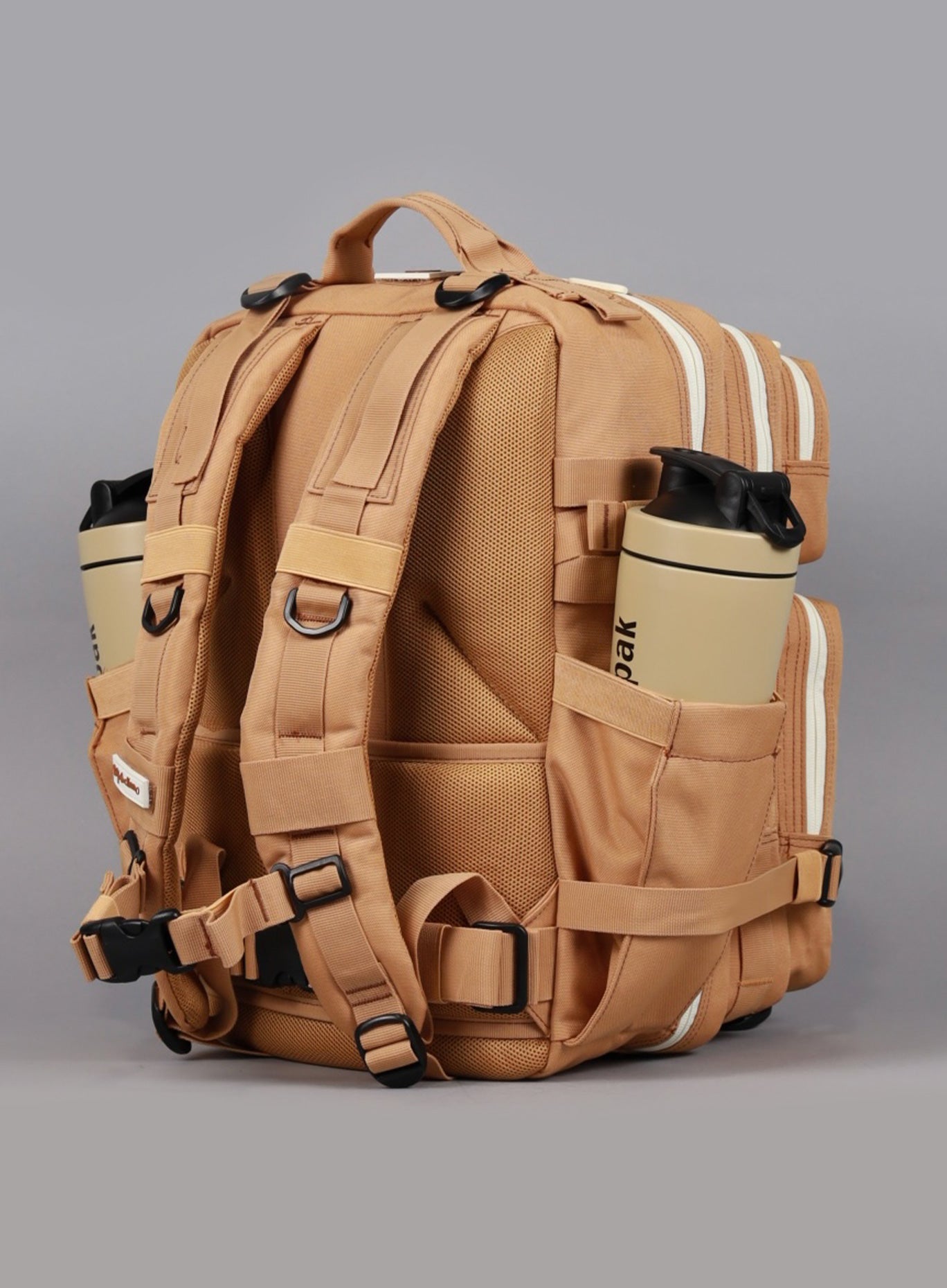 A rear view of the 35L Bombshell Sportswear backpack in Caramel color