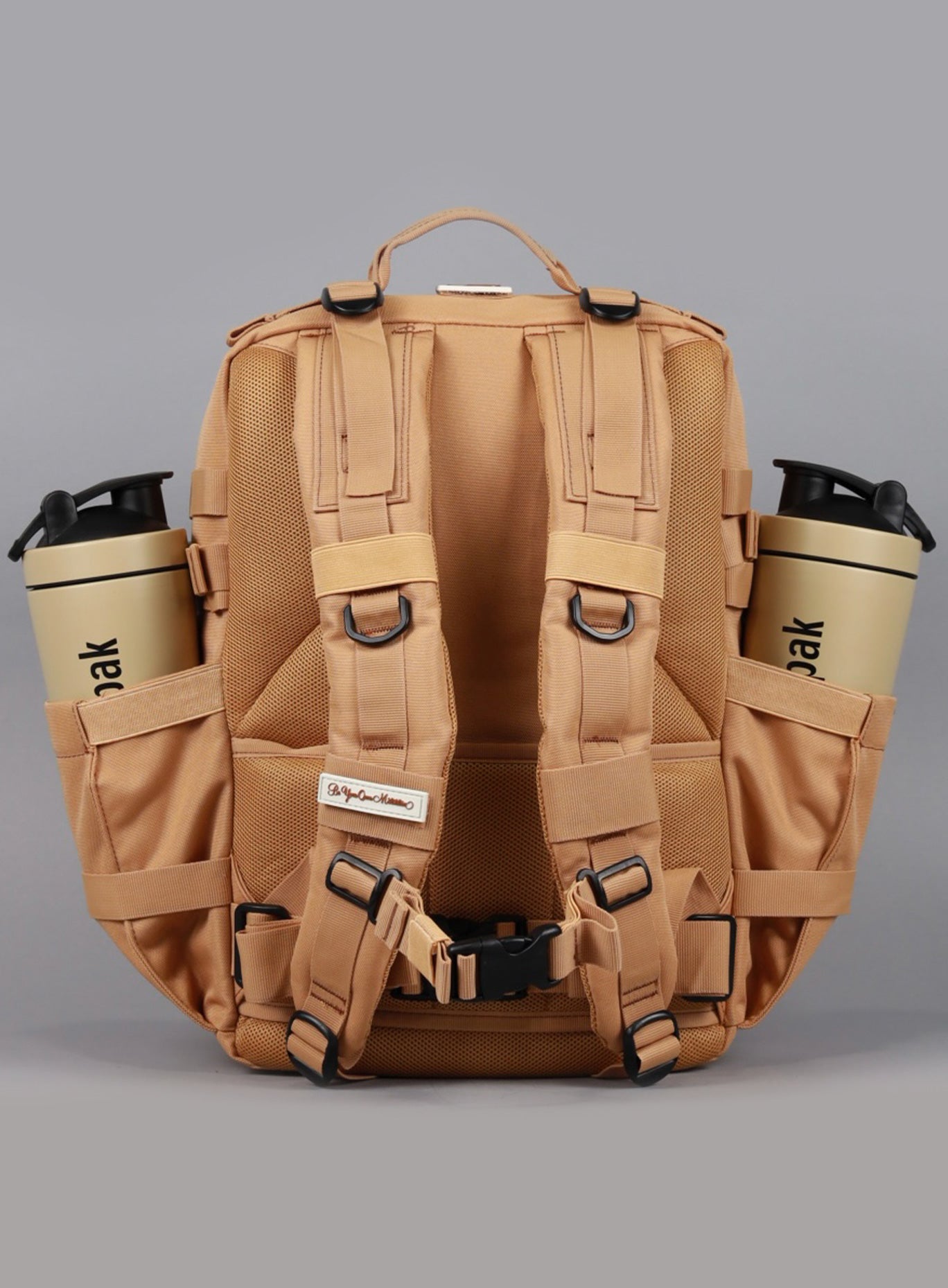 An image showcasing the back angle of the 35L Bombshell Sportswear backpack in Caramel color