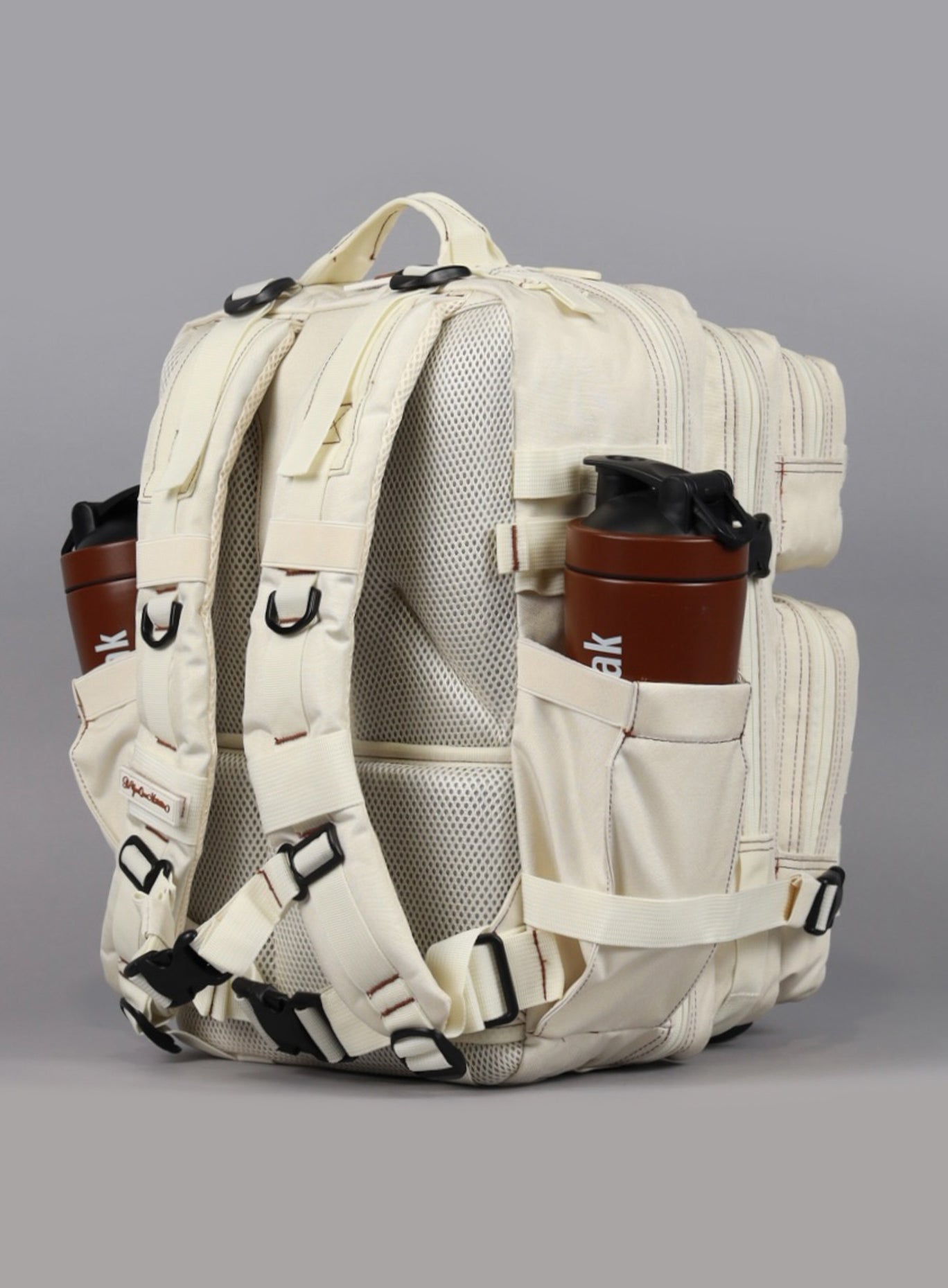 A rear view of the 35L Bombshell Sportswear backpack in  Crème color