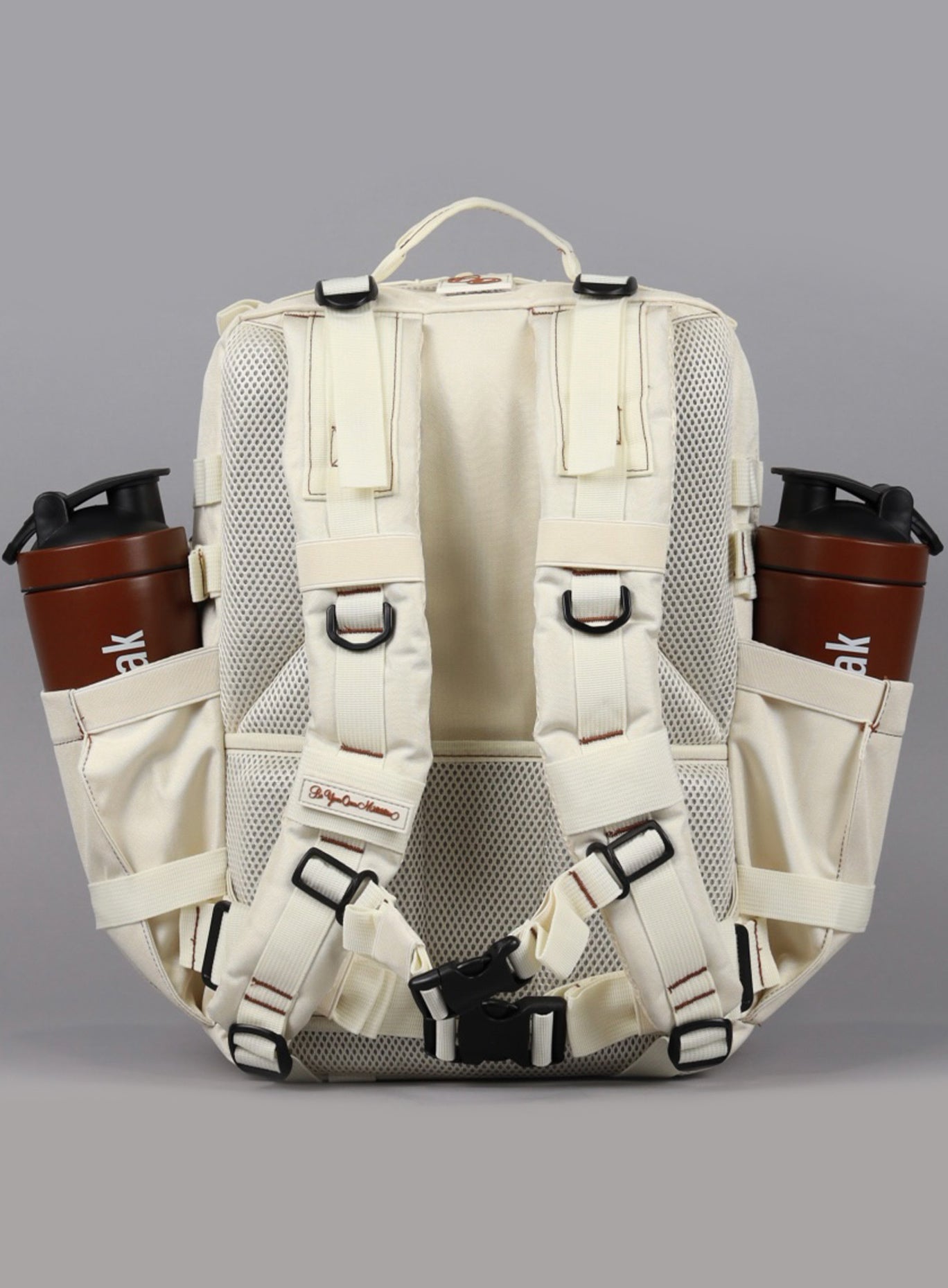 An image showcasing the back angle of the 35L Bombshell Sportswear backpack in  Crème color