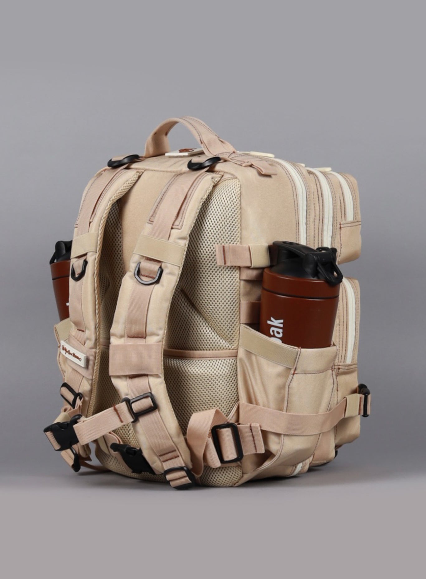 back left side view of the  25L Backpack Bombshell Sportswear in Latte color