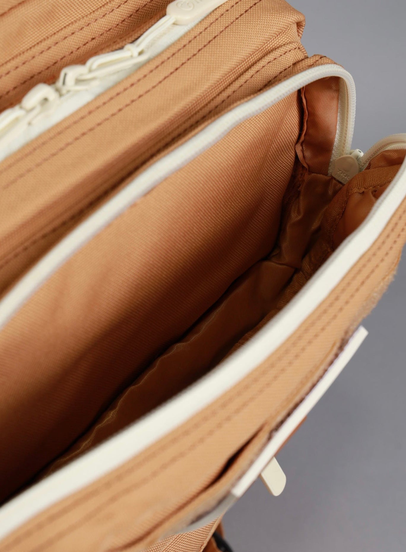 aerial view of the wolfpak mini backpack of 35L in caramel color 