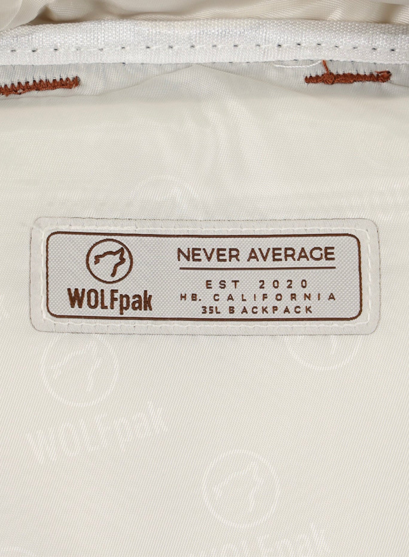 Picture of the wolfpak company badge inside the compartment of the 35L backpack 