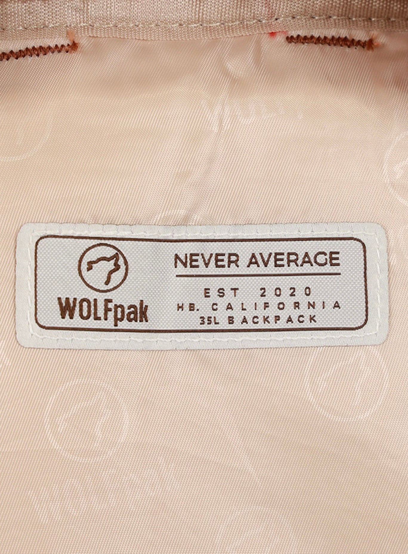 Zoomed in wolfpak label in the biggest compartment of the backpack