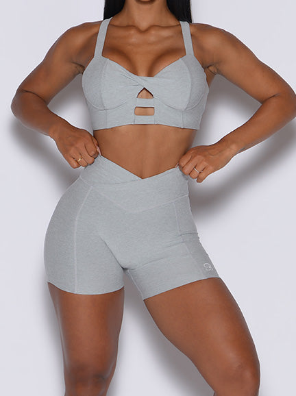 Zoomed in front view of model in our Tiny Waist Shorts and the Core Set Bra in Light Cloud color