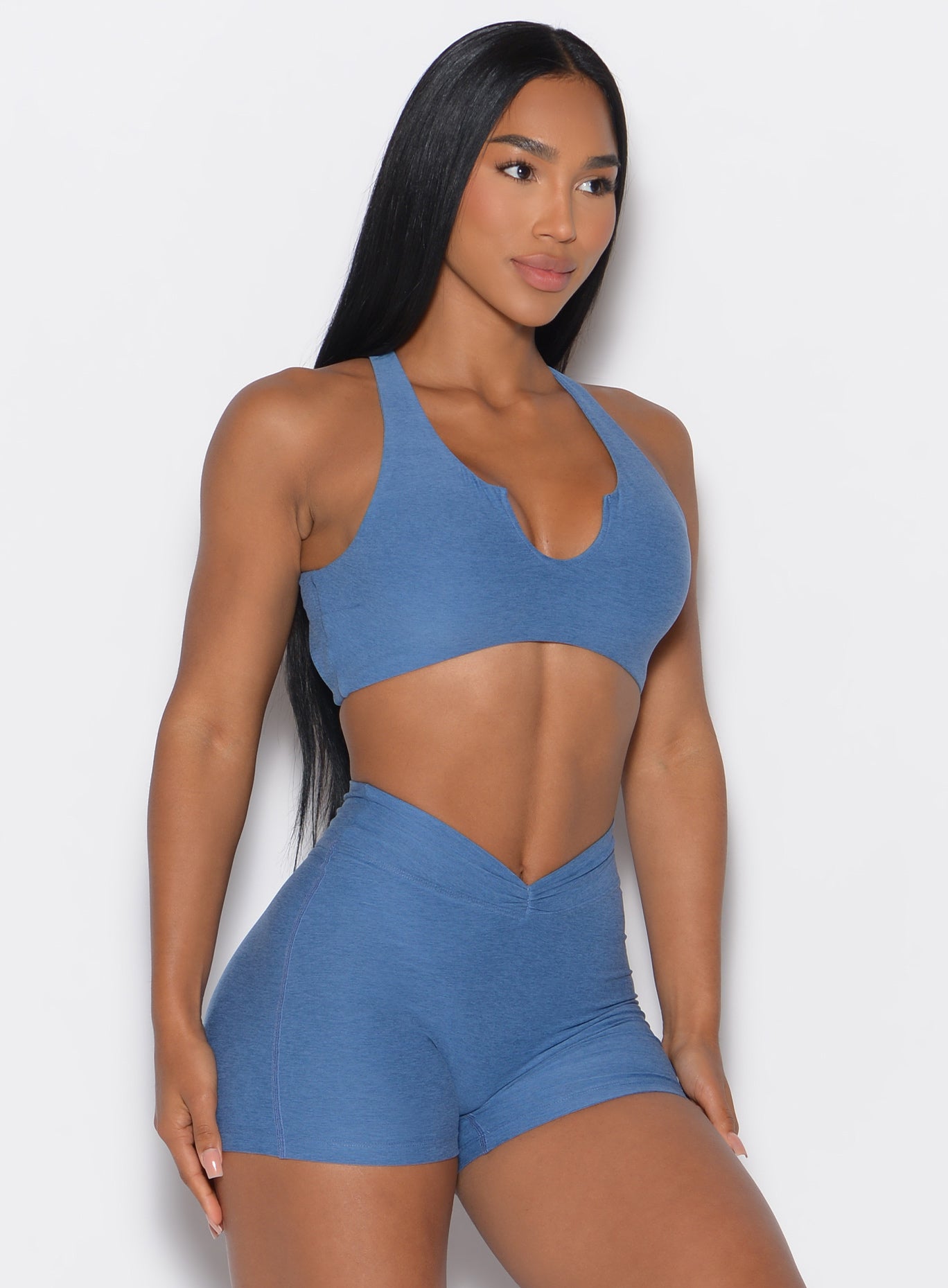 front profile picture of a model in our Ace Sports Bra and the matching shorts in Chambray color