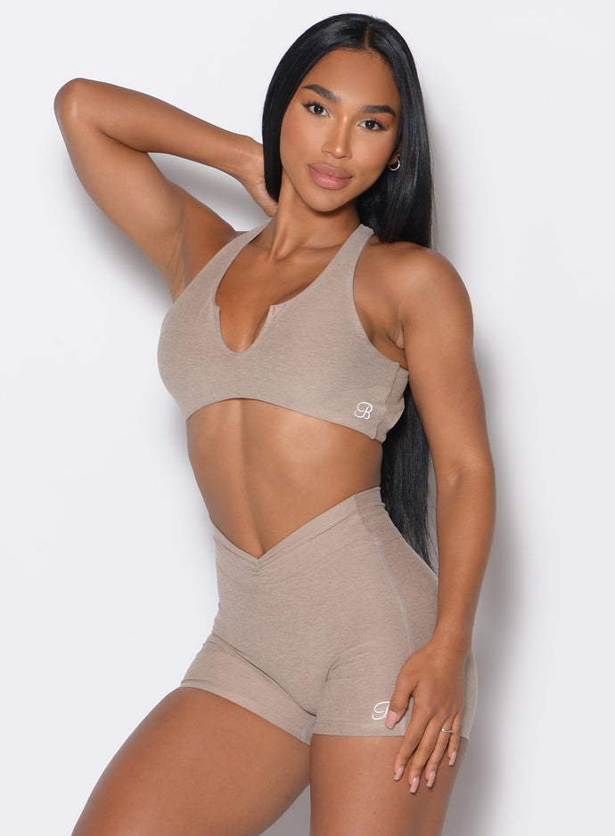 front profile picture of a model in our Ace Sports Bra and the matching shorts in Desert Taupe color