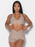 Model facing forward wearing our Ace Sports Bra and the matching shorts in Desert Taupe color