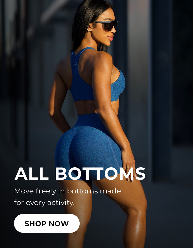 Right profile view of model wearing blue activewear shorts and activewear bra. Text reads ALL BOTTOMS move freely in bottoms made for every activity. SHOP NOW