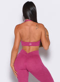 back profile shot of model in the v back leggings and backless bra