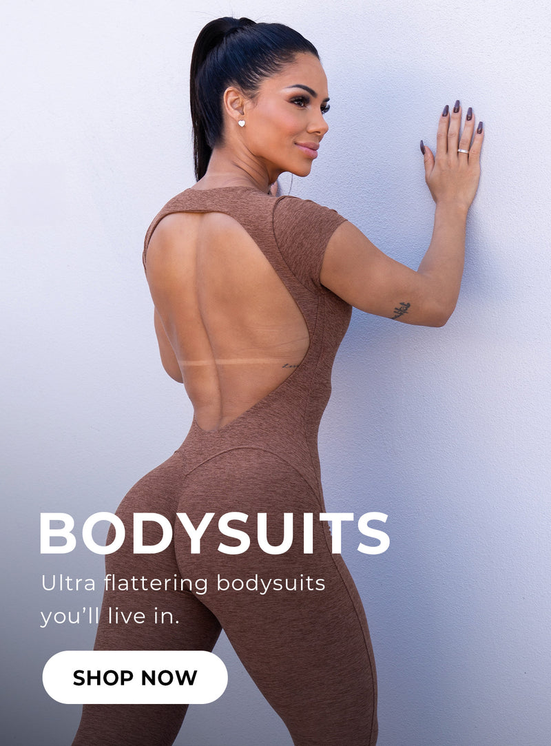 Back view image of model wearing the open back tee bodysuit in heathered brown. Text overlay reads BODYSUITS Ultra flattering bodysuits you'll live in. SHOP NOW