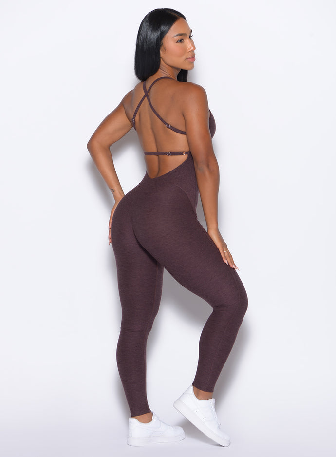 back right side profile view of our model wearing the Bombshell Bunny Bodysuit 2.0 in Peppercorn color