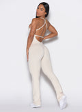 left side profile view of a model wearing our bombshell bunny bodysuit in Almond Milk color