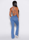 A model seen from the back, wearing the Bombshell Bunny Bodysuit  in Dusty Blue