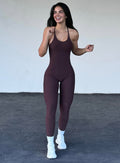 front view of model standing smiling wearing the bombshell bunny bodysuit 2.o in the color peppercorn