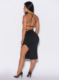 back  profile picture of a model wearing our black bombshell bunny dress