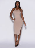 front profile picture of a model wearing our bombshell bunny dress in camel color