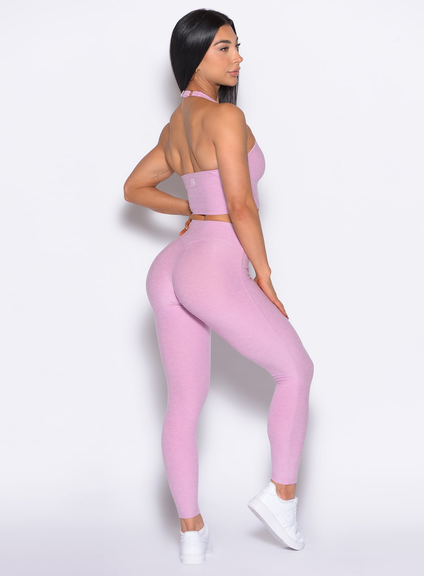 right side profile view of our model wearing the Bombshell Bunny Leggings in fondandt color