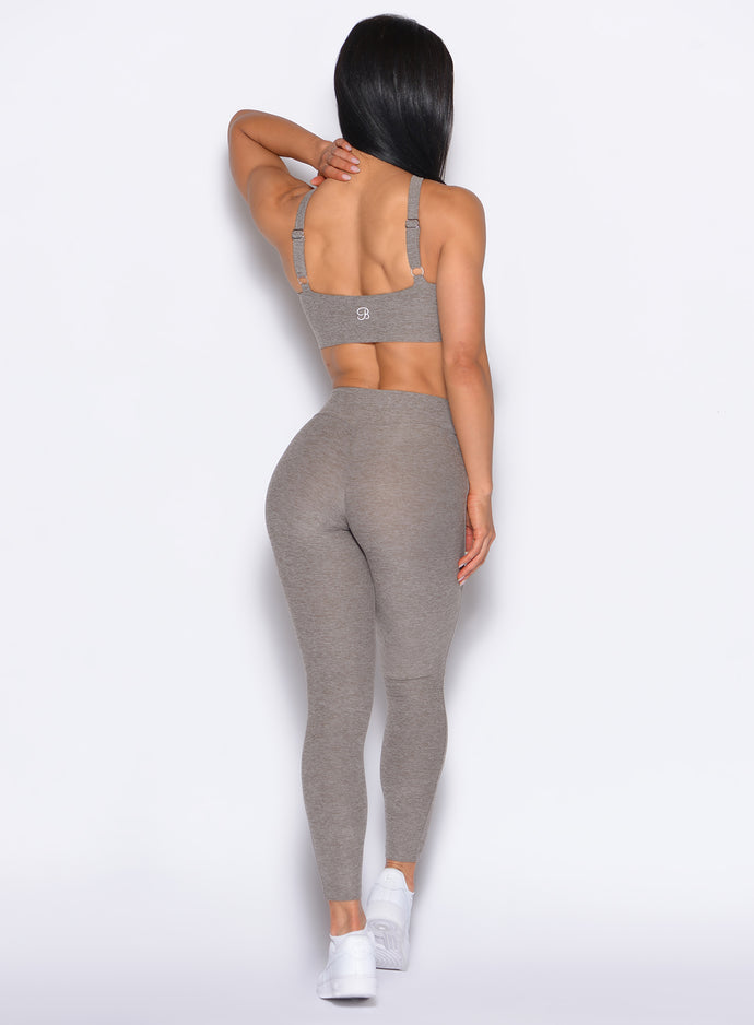 back profile view of our model wearing the Bombshell Bunny Leggings in smoked taupe color