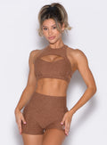 front profile view of a model wearing the Powerhouse bra in Coffee Bean color