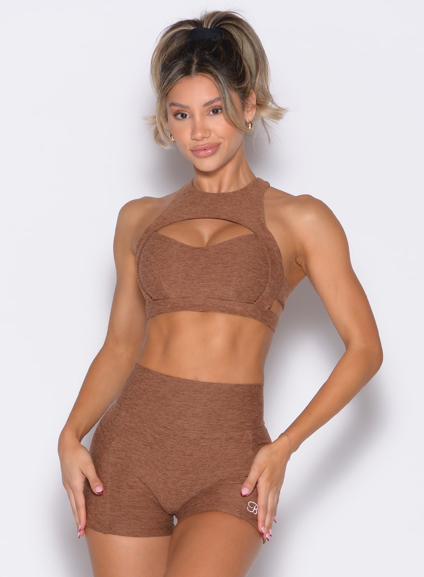 front profile view of a model wearing the Powerhouse bra in Coffee Bean color