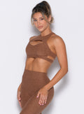 front left side profile view of a model wearing the Powerhouse bra in Coffee Bean color