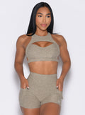 front profile view of a model with both hands inside the pockets and looking to the left wearing the Powerhouse bra in Toasted Sugar color