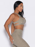 right side profile view of a model wearing the Powerhouse bra in Toasted Sugar color