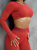 close up front right side profile view of a model wearing the Bombshell Active Pullover in Red Ochre color