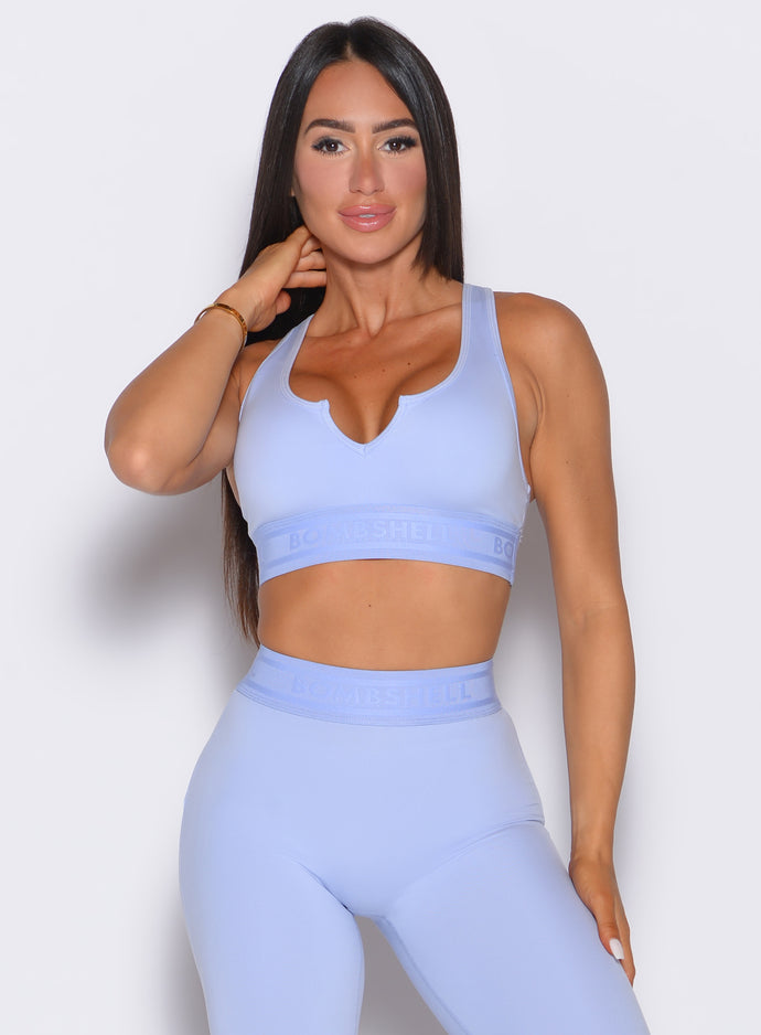 front profile view of our model wearing the Bombshell Active Bra in Baby Lavender color paired with the matching leggings