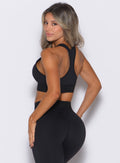 back left side profile view of our model wearing the Bombshell Active Bra in Black color