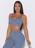 front profile view of our model wearing the Bombshell Active Bra in Flinstone color paired with the matching leggings