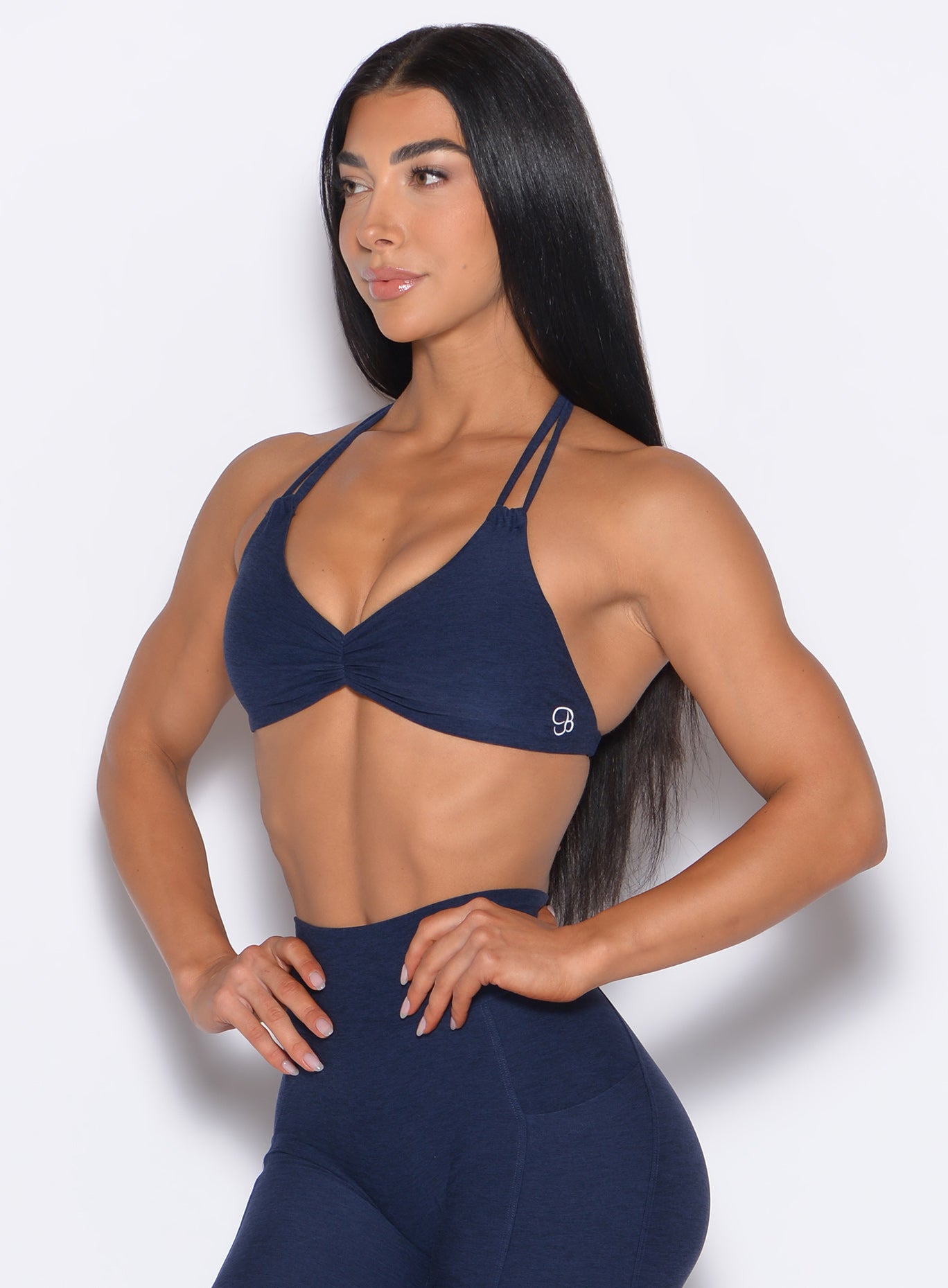 front left side profile view of our model wearing the Butterfly Sports Bra in Cosmic Blue color