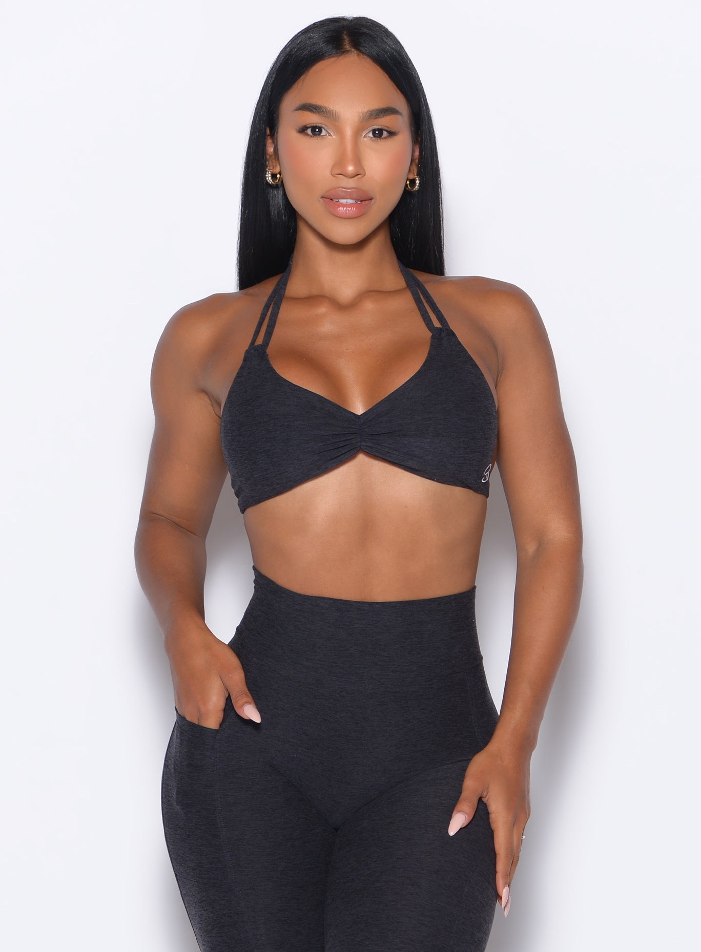 front profile view of our model wearing the Butterfly Sports Bra in Onyx color