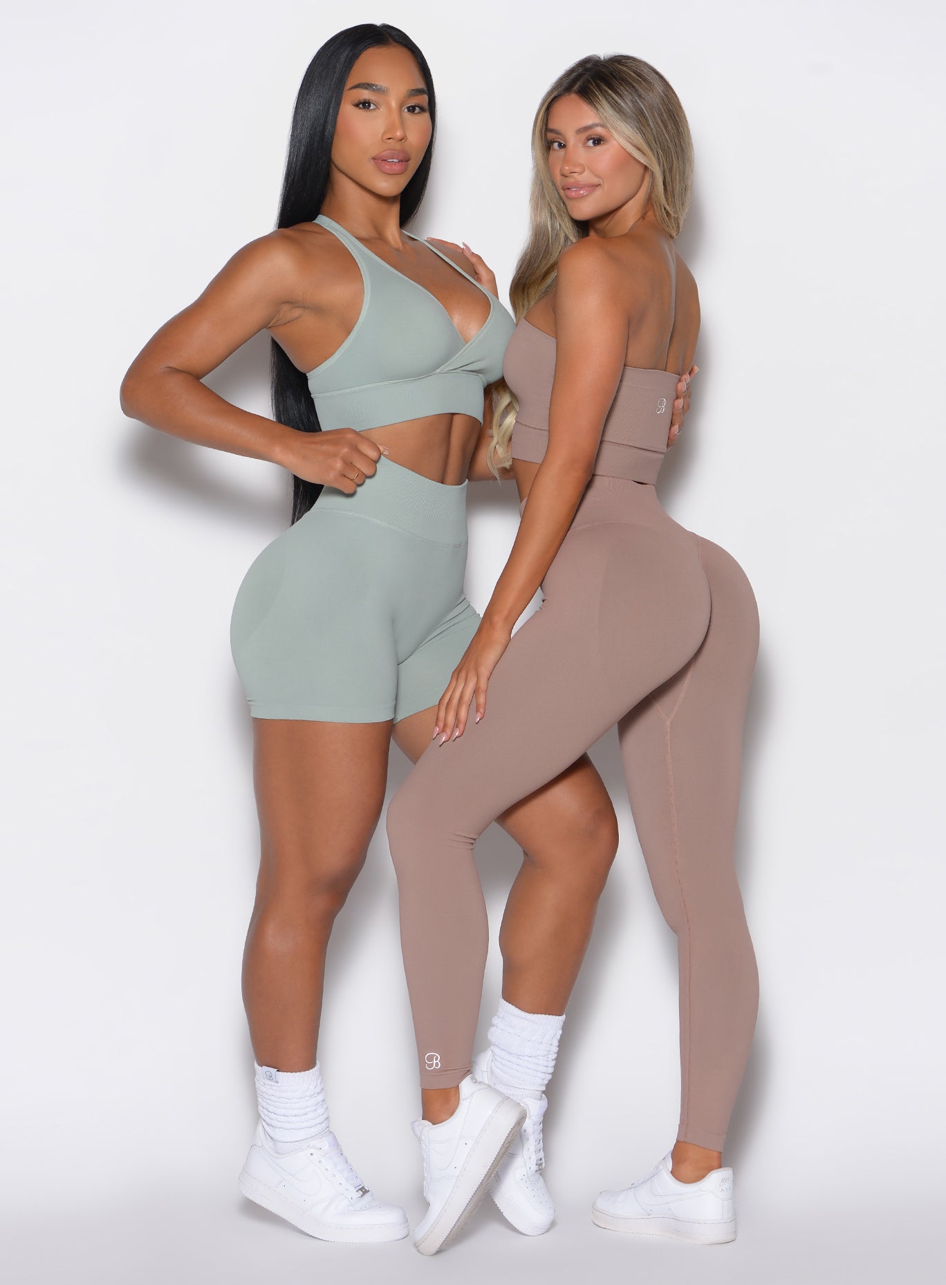 a picture of two models facing each other and wearing our cheeky seamless leggings sets 