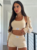 Front profile shot of our model wearing the Cloud Comfort Shorts in vanilla color paired with the matching bra and jacket