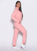 right side profile view of a model wearing the Cloud Comfort Joggers in Peachy pink color